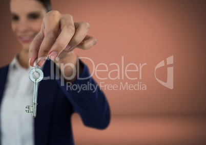 Woman holding key in front of Vignette