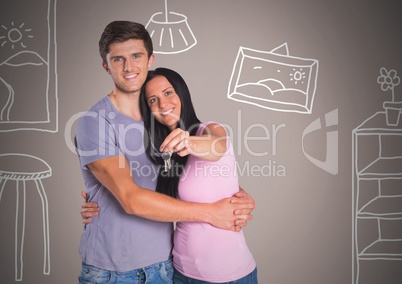 Couple Holding key with home room drawings in front of vignette