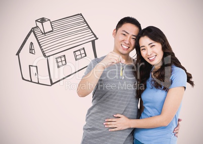 Couple Holding key with house drawing in front of vignette