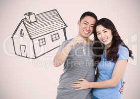 Couple Holding key with house drawing in front of vignette