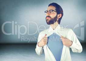 Millennial man opening shirt in blue room