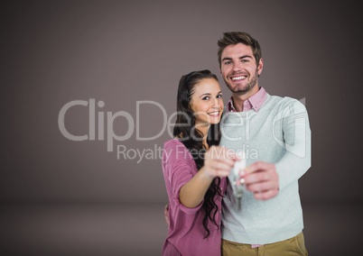 Couple Holding key in front of vignette