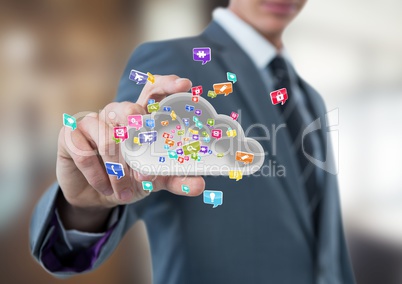 businessman with hand spread of  taking cloud with application icons. Business blurred background