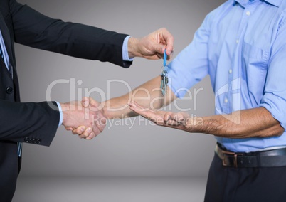 Holding key in front of vignette with handshake