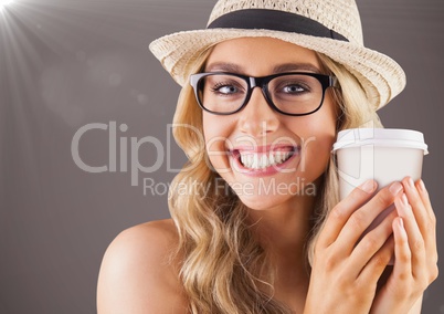 Close up of millennial woman smiling with coffee and flare against brown background