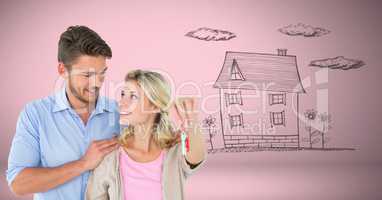 Couple Holding key house home drawing in front of vignette