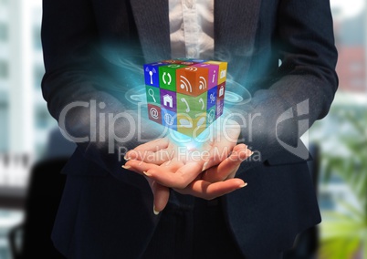 hands with cube of application icons with blue lights