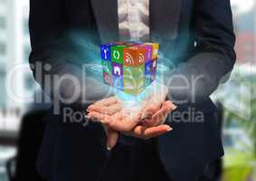 hands with cube of application icons with blue lights