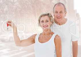Couple  Holding key in front of street
