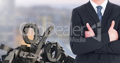 Broken concrete stone with percentage symbol and businessman in cityscape