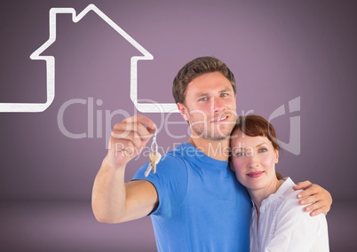 Couple Holding key with house icons in front of vignette Couple Holding key with house icons in front of vignette