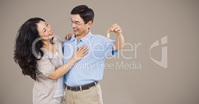 Couple Holding key in front of vignette