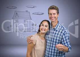 Couple Holding key with house drawing in front of vignette