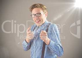 Nerd man pointing against brown background with flare