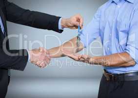 Men holding keys handshake in front of vignette