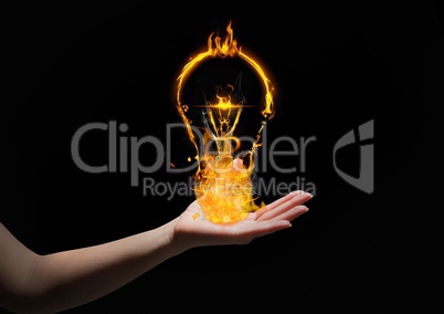 hand with light fire icons over. Black background