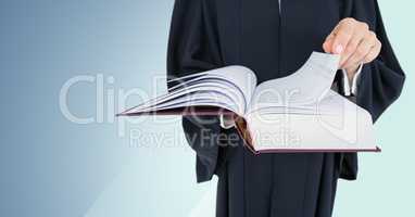 Judge mid section reading against blue background