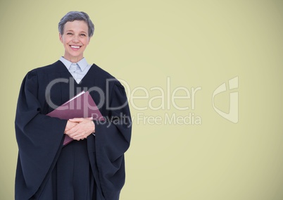 Female judge with book against light green background