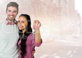 Couple  Holding key in front of street road