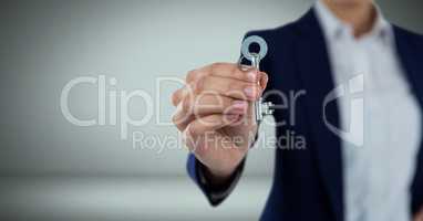 Hand holding key in front of Vignette