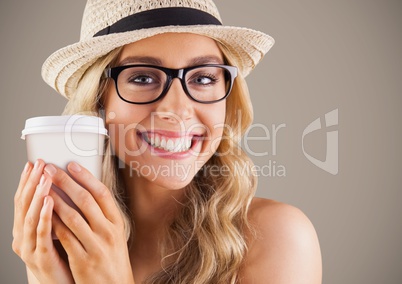 Close up of millennial woman with coffee against brown background Close up of millennial woman with coffee against brown background