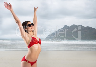 Woman in red bikini against blurry beach Woman in red bikini against blurry beach
