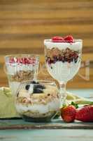 Cup of cereals with fruits and yogurt