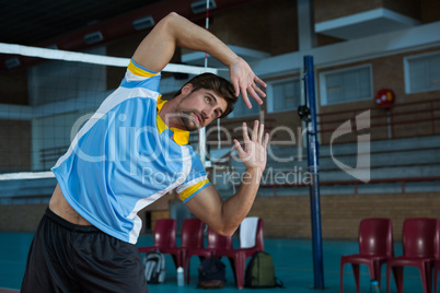 Volleyball player exercising at court