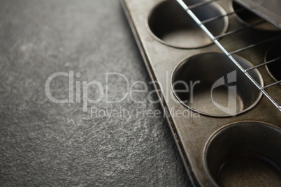 Cropped image of cooling rack on muffin tin