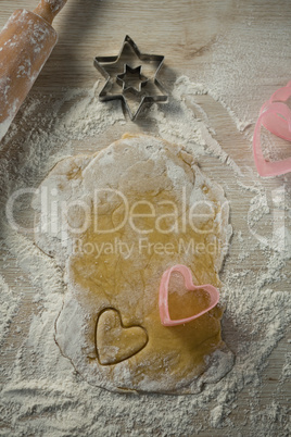 Overhead view of heart shape cutter on dough