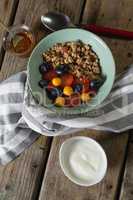 Fruit cereal in bowl on a wooden table