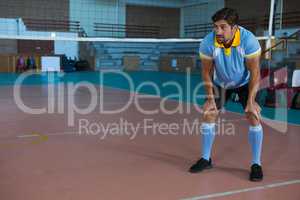 Volleyball player looking away at court