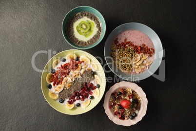 Various fruit cereals on concrete background