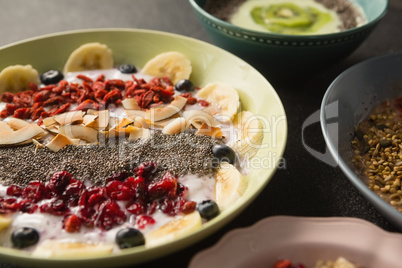 Fruit cereal in bowl on a concrete background
