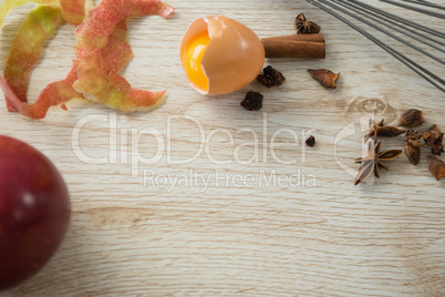 High angle view of broken egg with spices