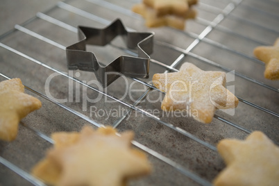 High anlge view of star shape cookies on cooling rack