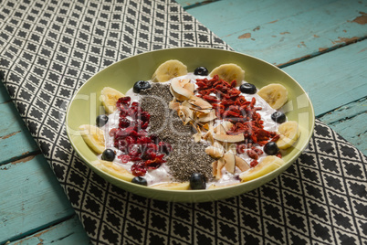 Fruit cereal in plate on a napkin cloth