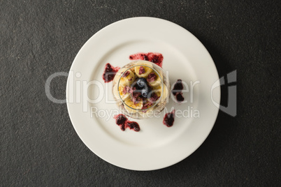 Fruit cereal in jar on concrete background