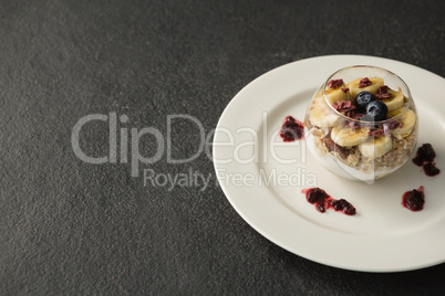 Fruit cereal in jar on concrete background