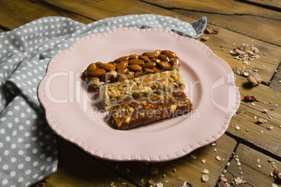 Three dry fruits bars arranged in plate