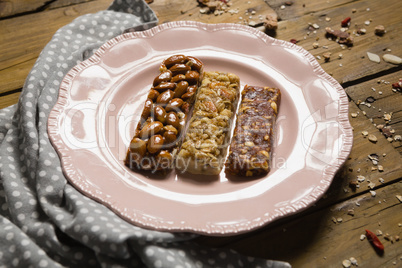 Three dry fruits bars arranged in plate