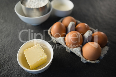 High angle view of butter and eggs on table