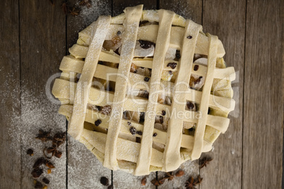 Directly above shot of apple pie in baking pan by spices