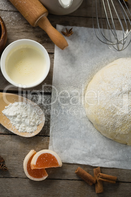 Directly above shot of kneaded dough amidst various ingredients