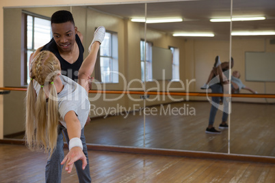 Dancers looking each other at studio