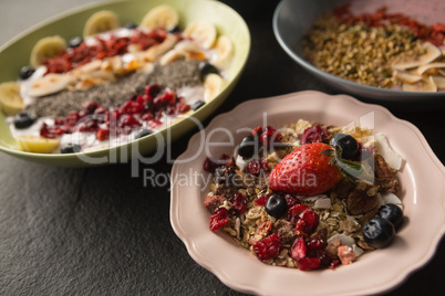 Various fruit cereals on concrete background