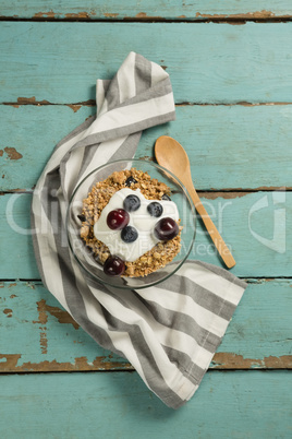 Bowls of breakfast cereals and fruits with yogurt