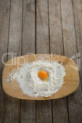 Egg yolk in flour on cutting board
