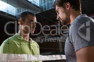 Aggressive volleyball players looking at each other