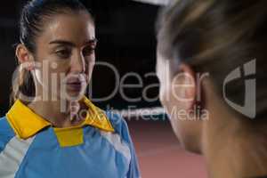 Volleyball player looking at teammate